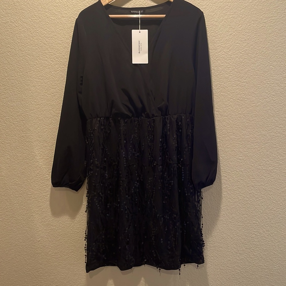 Black v-neck dress with sparkly sequin embellishment skirt